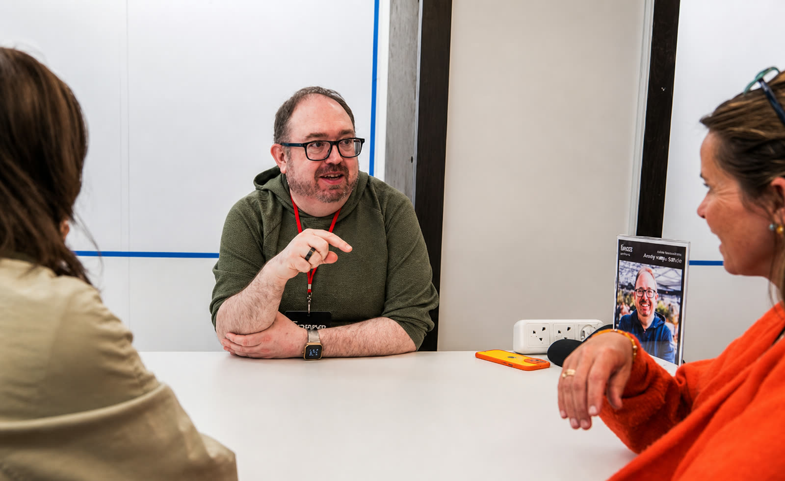DC in a one-to-one advisory conversation with two founders in a broadcast studio.